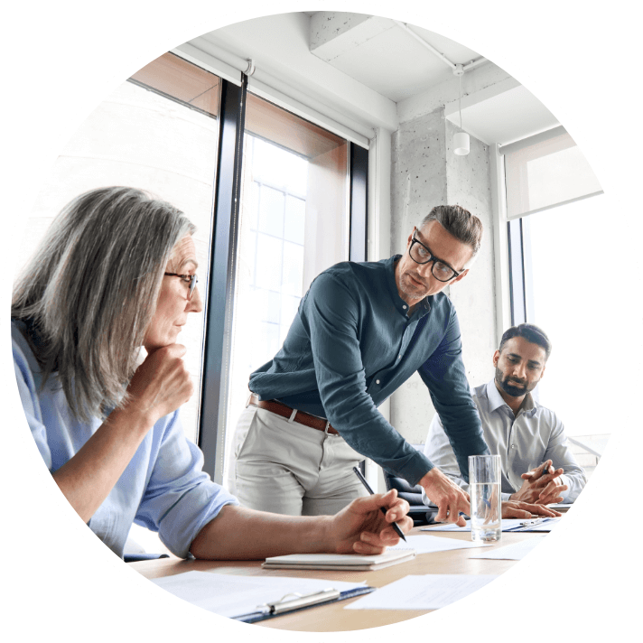 Three people in a meeting room